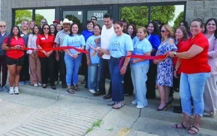 Ribbon gets cut on Fresh Pressed on North Kansas Ave.