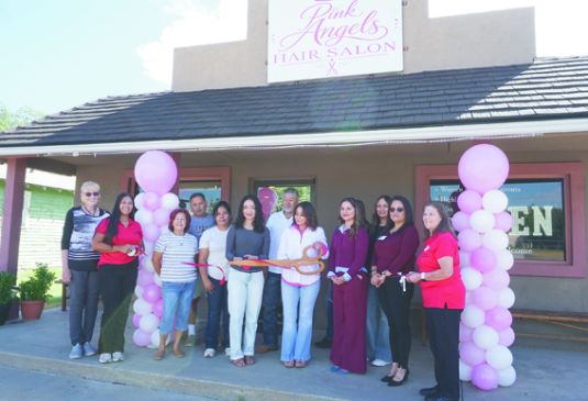 Pink Angels Hair Salon cuts ribbon on new salon