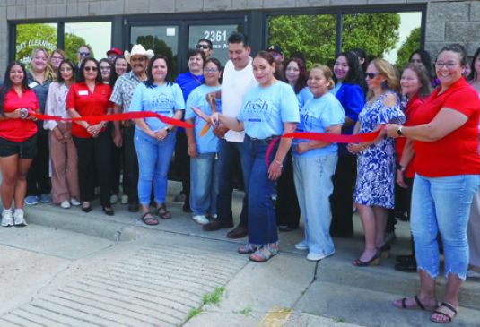 Ribbon gets cut on Fresh Pressed on North Kansas Ave.